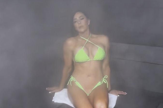 Woman relaxing in steam room at Bionic Barbell Las Cruces